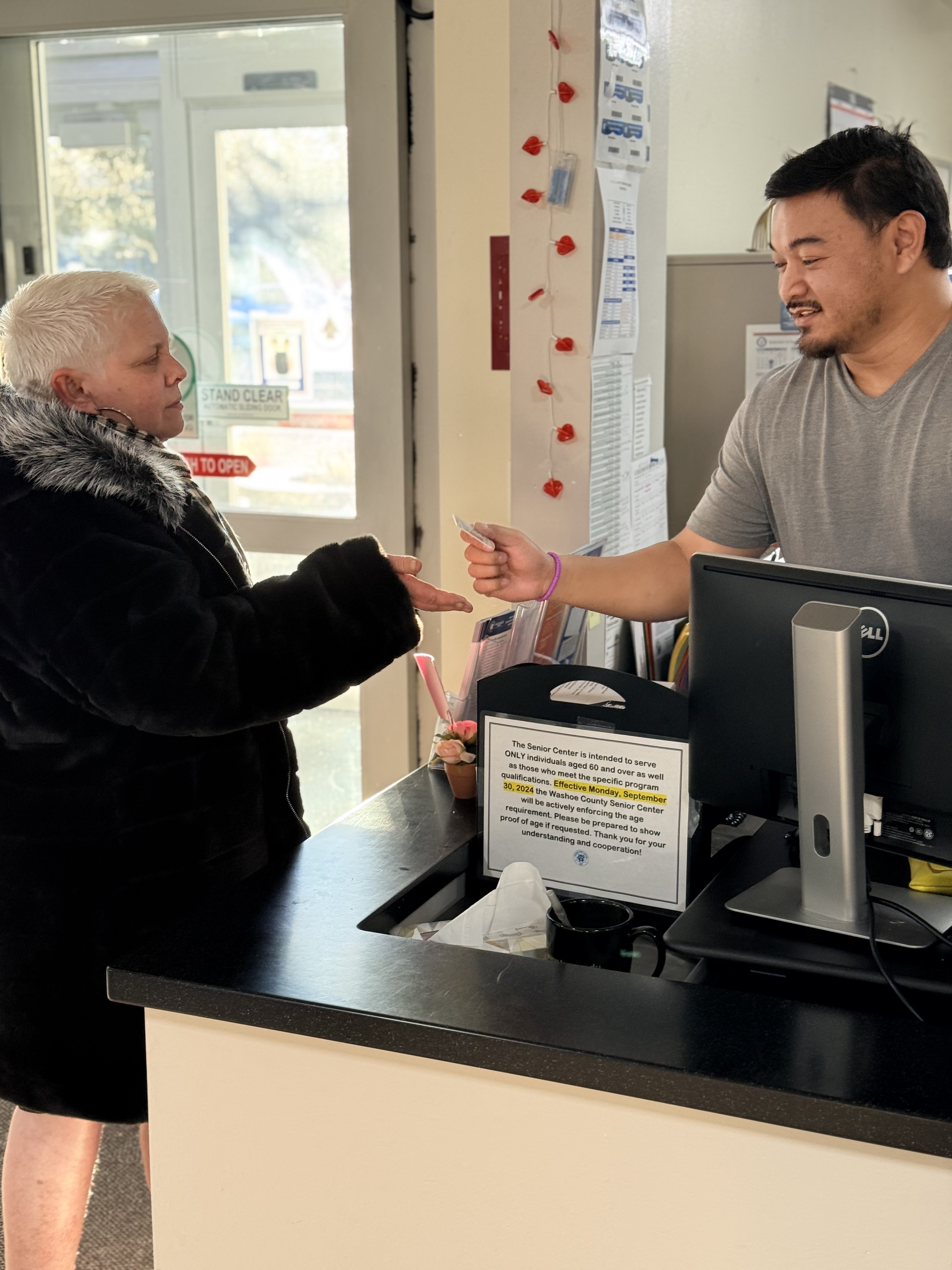 Image of a worker helping a customer